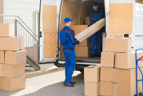 Flat removals team handling access challenges in a Harrow apartment building