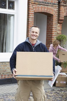 Moving boxes and a removal van during a home move in Harrow