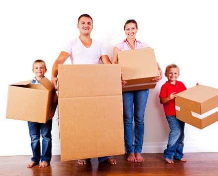 Mover carrying boxes safely with protective equipment
