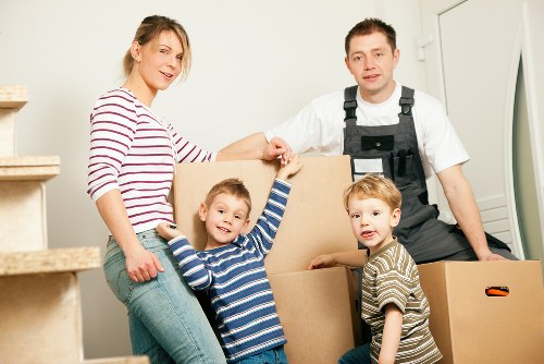 Organised storage unit in Harrow with boxes and furniture arranged efficiently