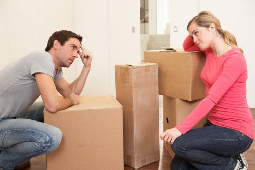 Professional mover handling furniture during a Harrow relocation