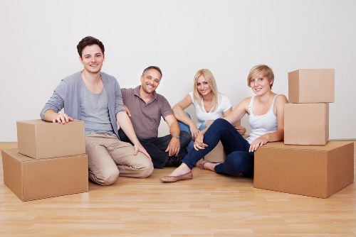 Local commercial movers unloading equipment at a new workspace