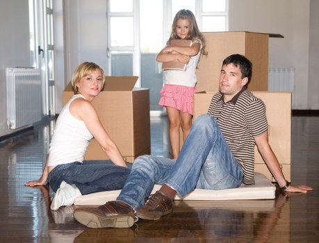 Harrow removal team handling furniture and packing materials